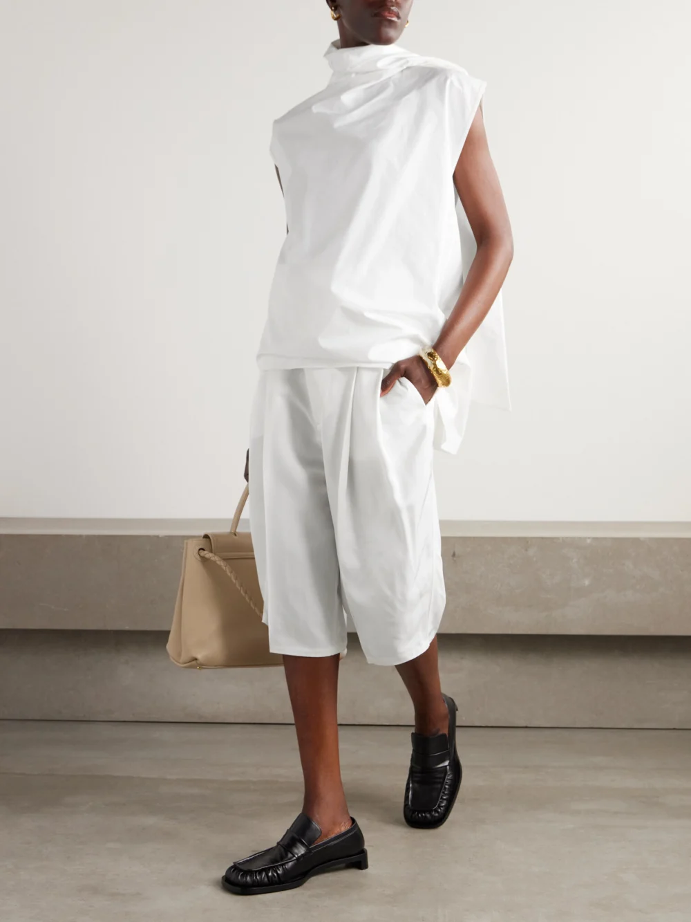 Carven Pleated Gabardine Shorts, worn by a model