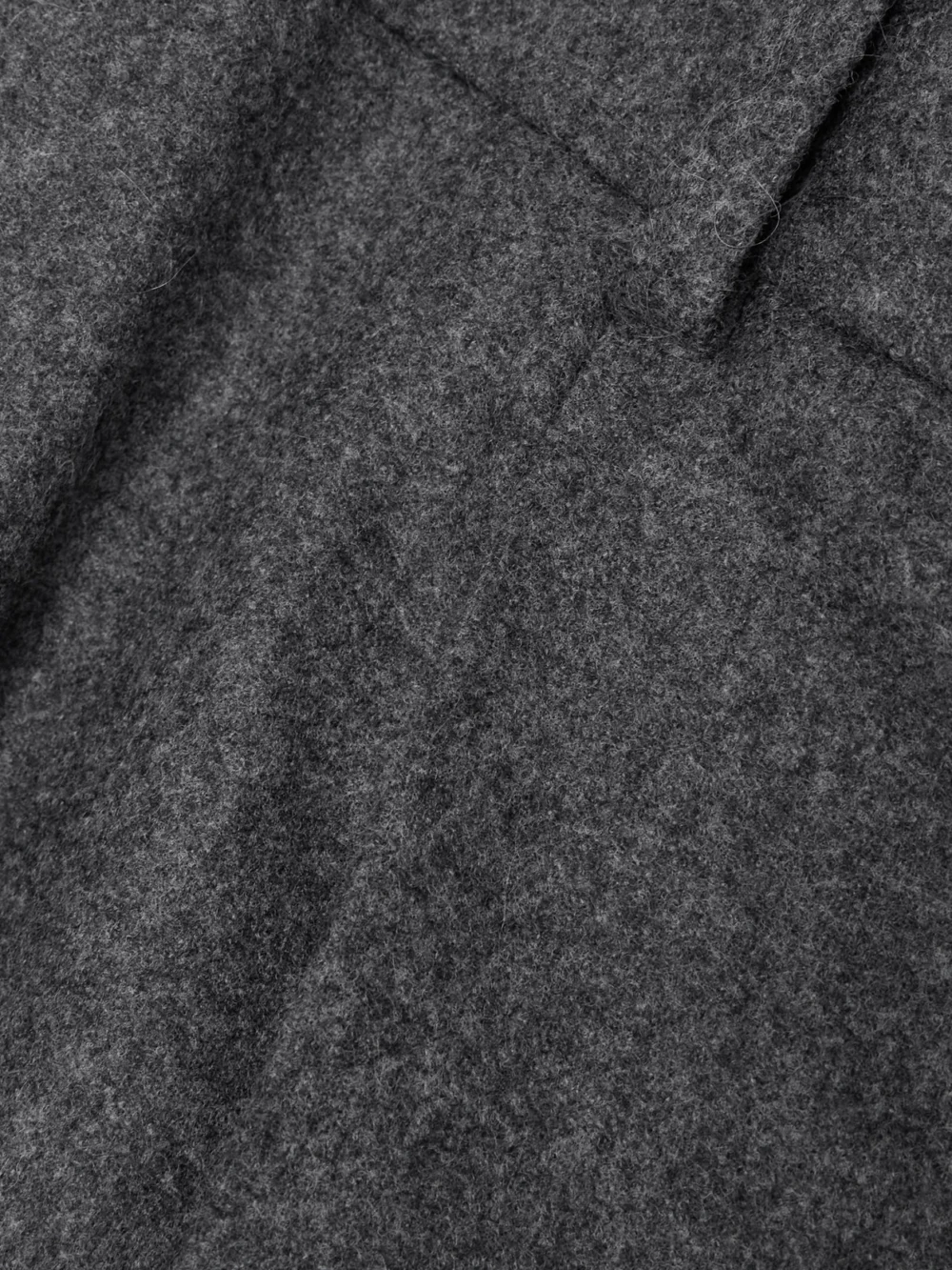 Close-up detail of the Carven Pleated Wide-leg Wool Trousers