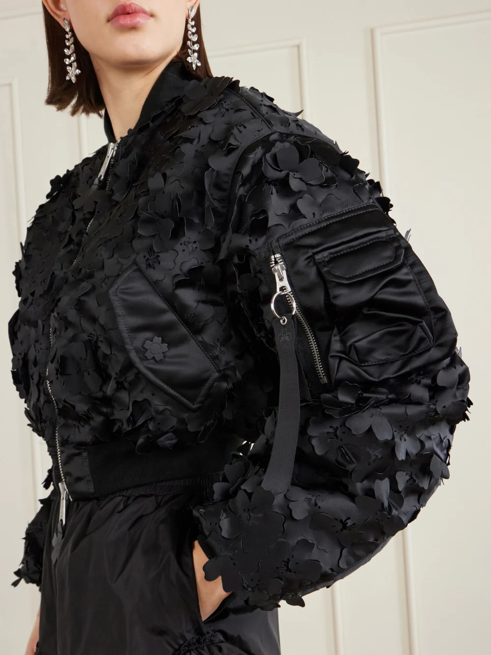 Close-up detail of the Cecilie Bahnsen + Alpha Industries Ma-1 Cropped Laser-cut Padded Shell Bomber Jacket