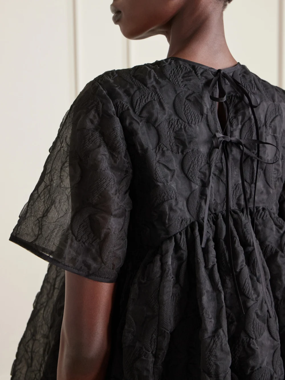Close-up detail of the Cecilie Bahnsen Britney Pleated Tie-back Tulle Mini Dress