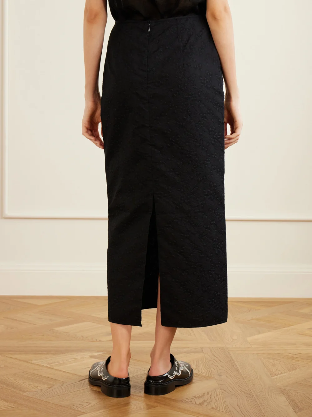 Back view of the Cecilie Bahnsen Cbuka Cotton-blend Matelassé Midi Skirt