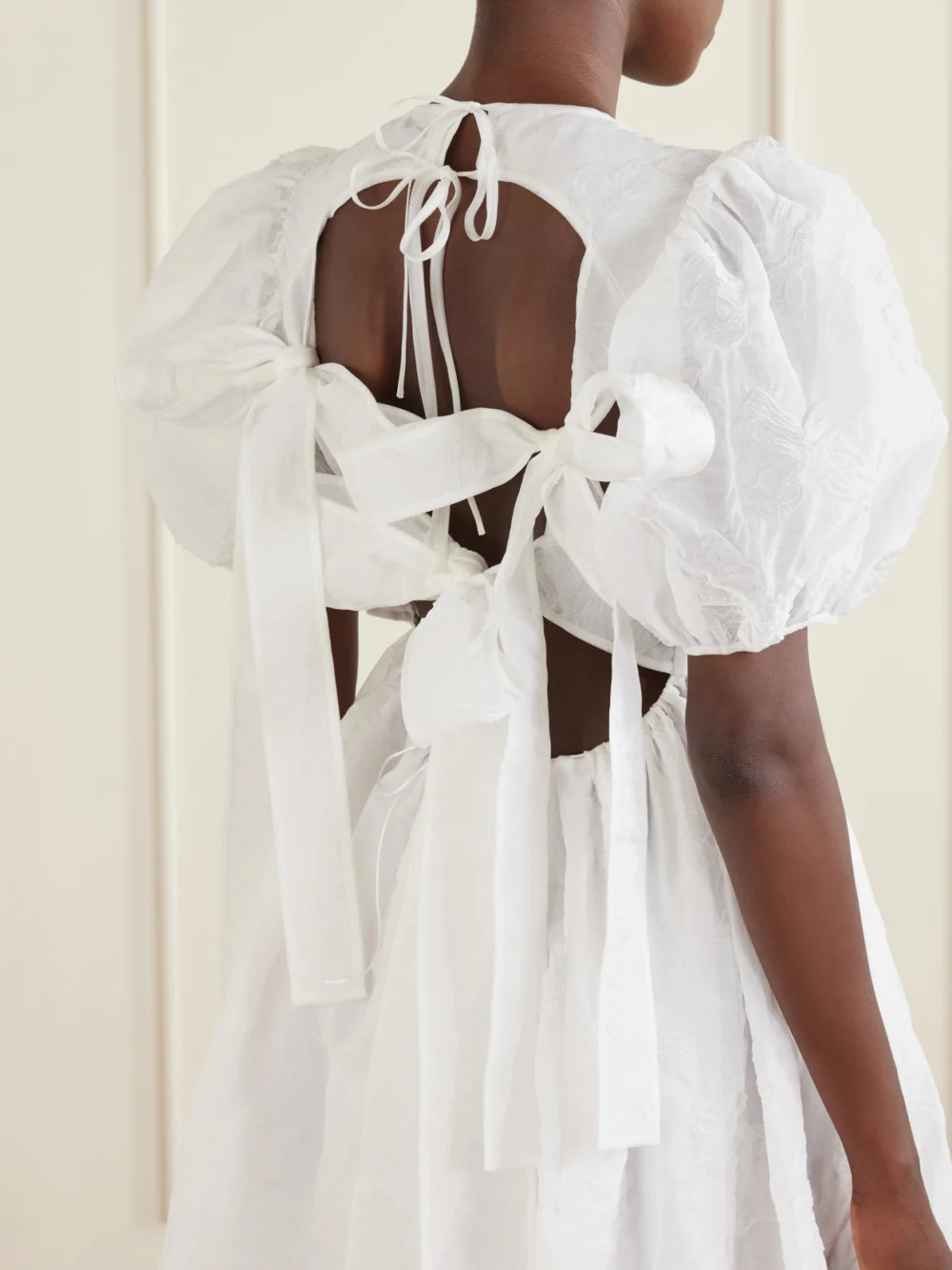 Close-up detail of the Cecilie Bahnsen Crinkled Papillon Matelassé Midi Dress