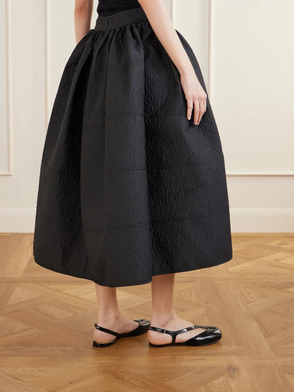 Back view of the Cecilie Bahnsen Daphne Pleated Cloqué Midi Skirt