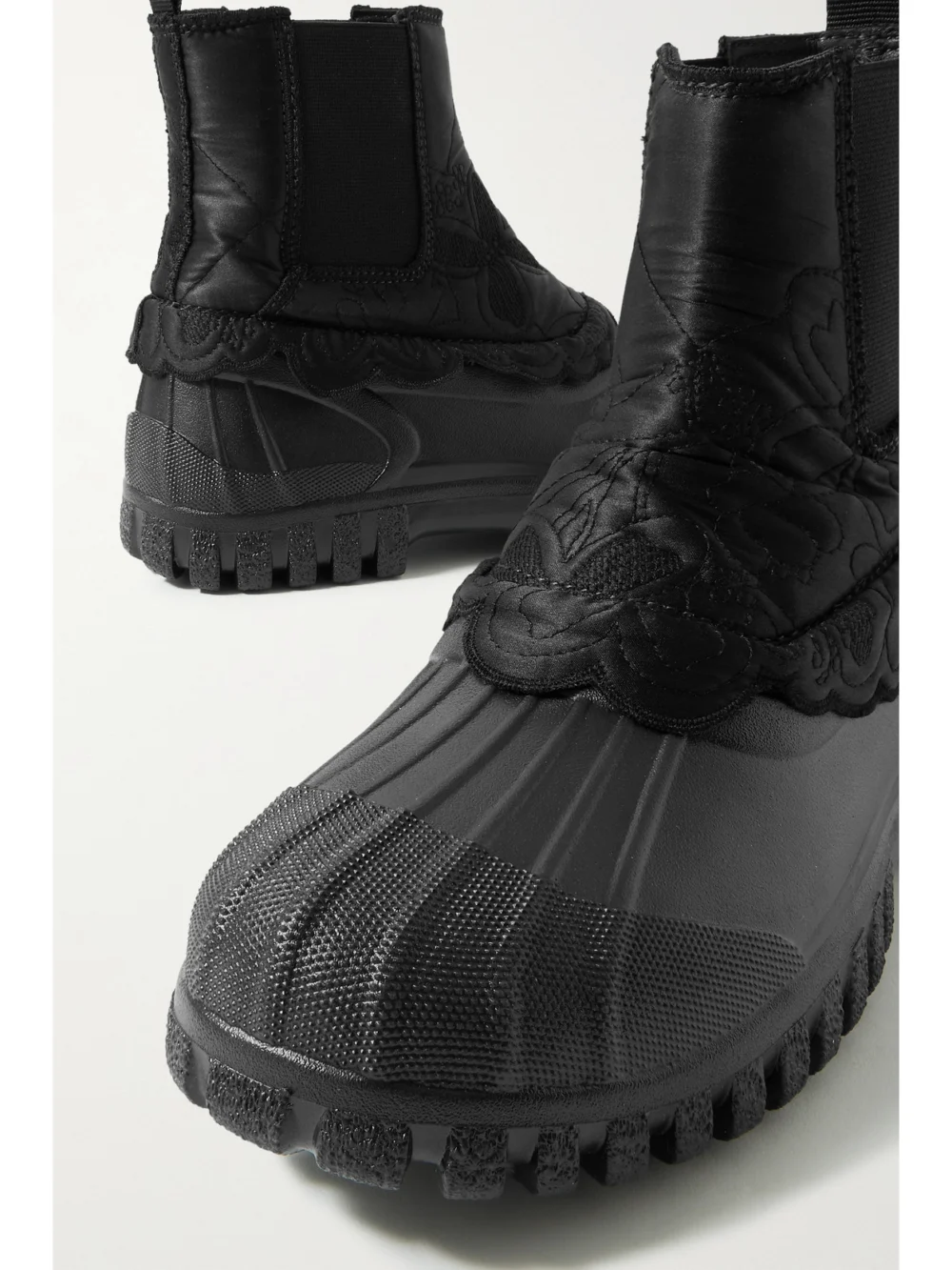 Close-up detail of the Cecilie Bahnsen Julian Scalloped Quilted Silk and Rubber Chelsea Boots