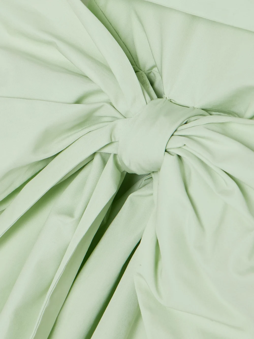 Close-up detail of the Cecilie Bahnsen Valentina One-shoulder Bow-detailed Cotton-poplin Dress