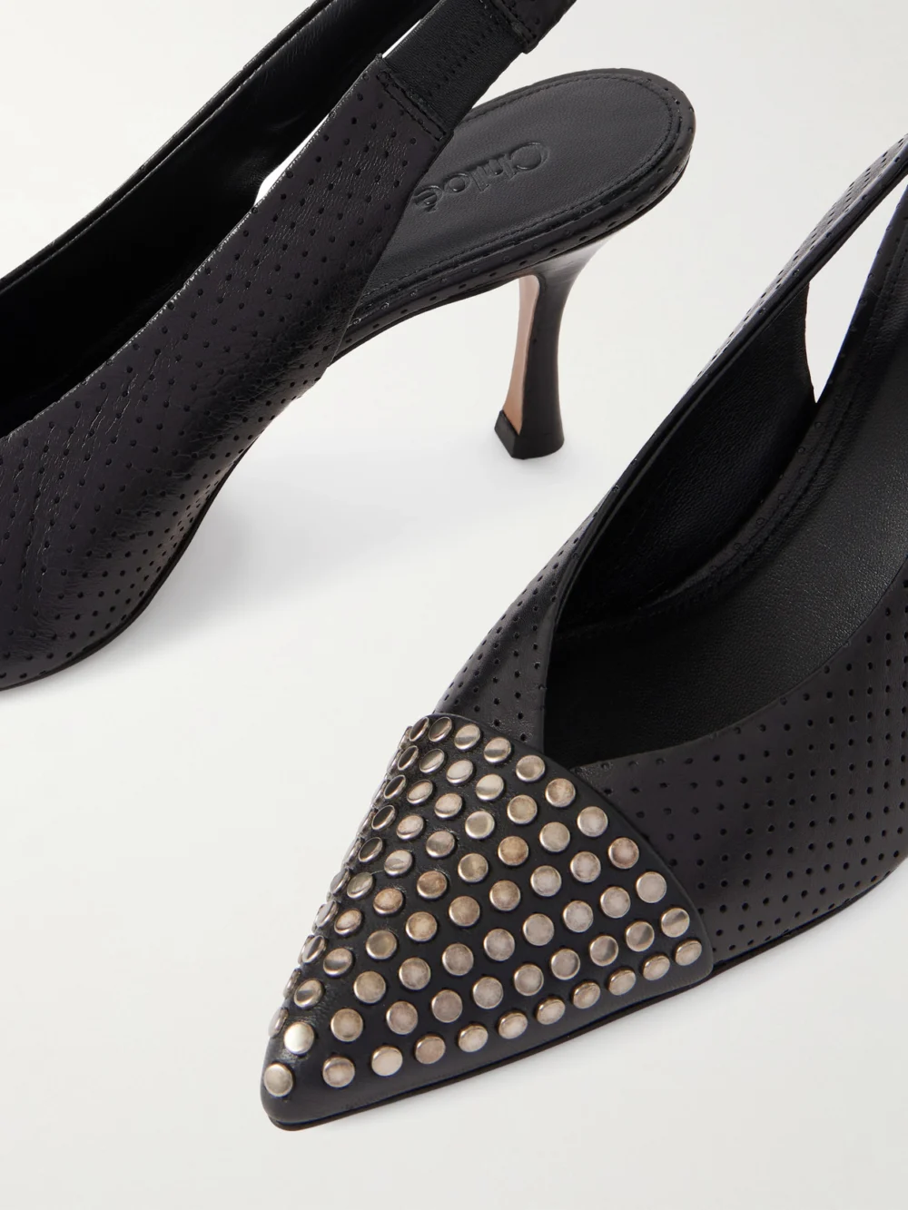 Close-up detail of the Chloé Alba Studded Perforated Leather Pumps