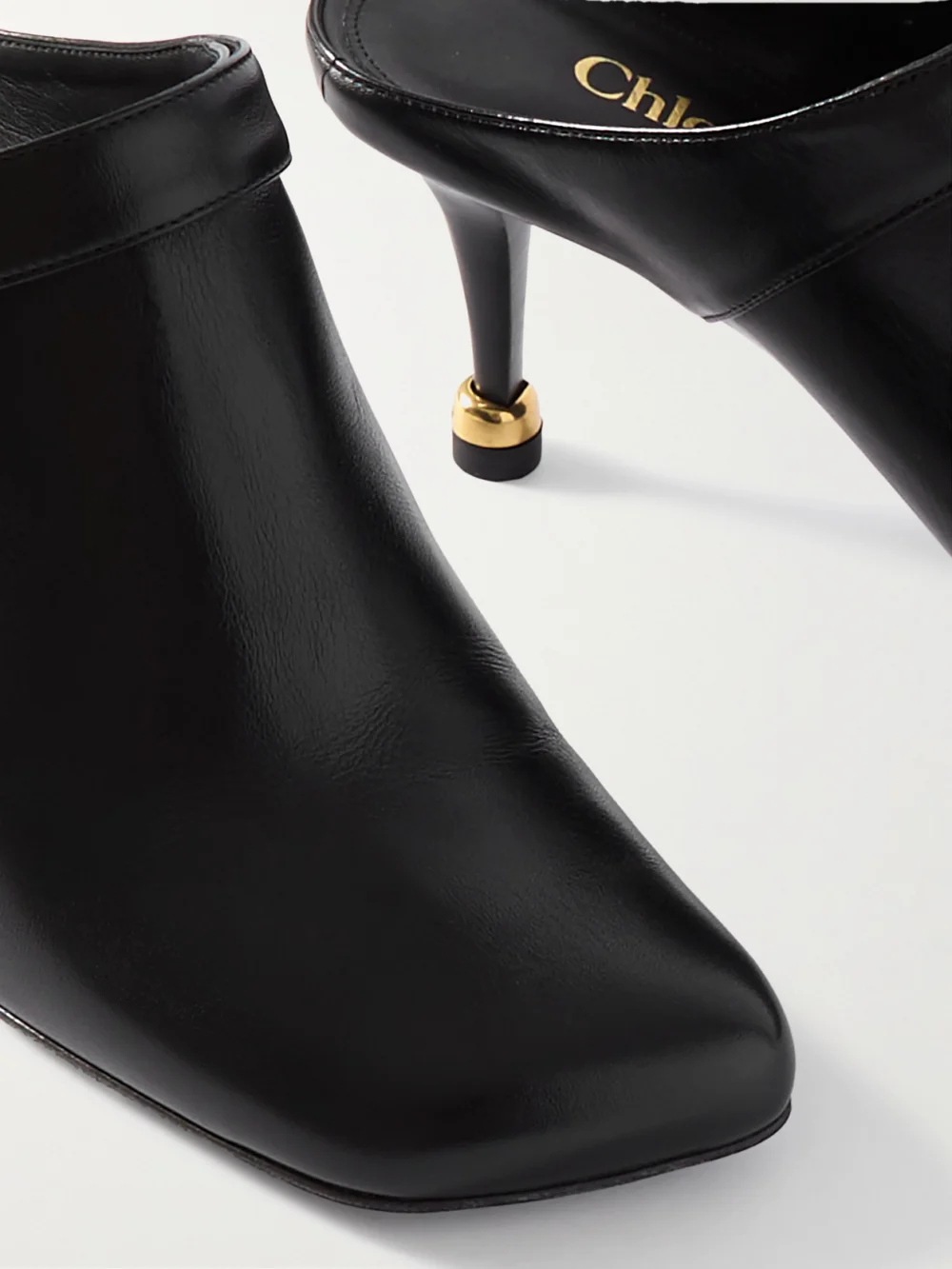 Close-up detail of the Chloé Andrea Buckled Leather Mules