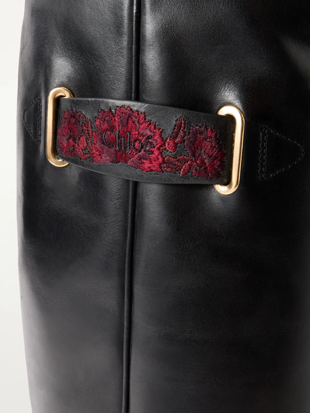 Close-up detail of the Chloé Azelan Embroidered Leather Knee Boots
