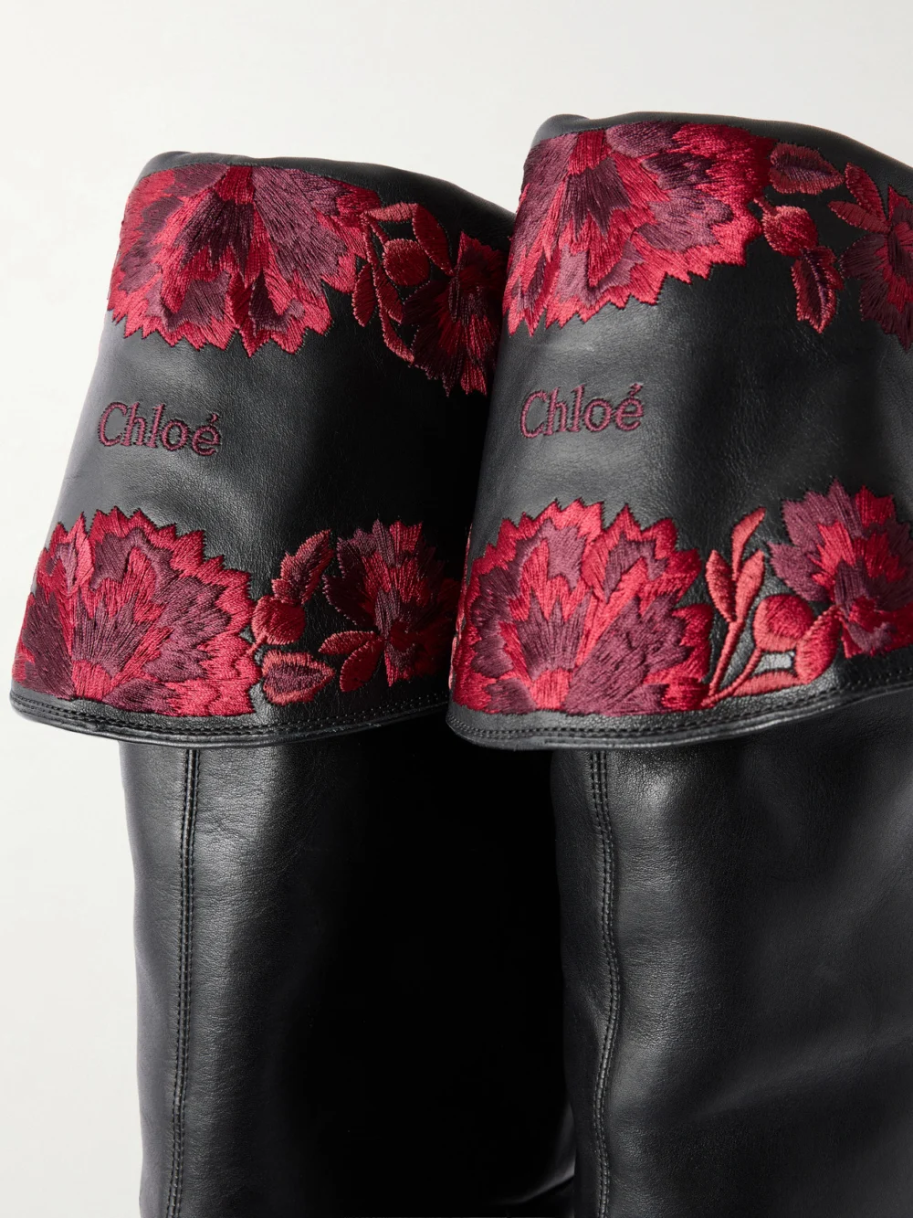 Close-up detail of the Chloé Azelan Floral-embroidered Leather Over-the-knee Boots