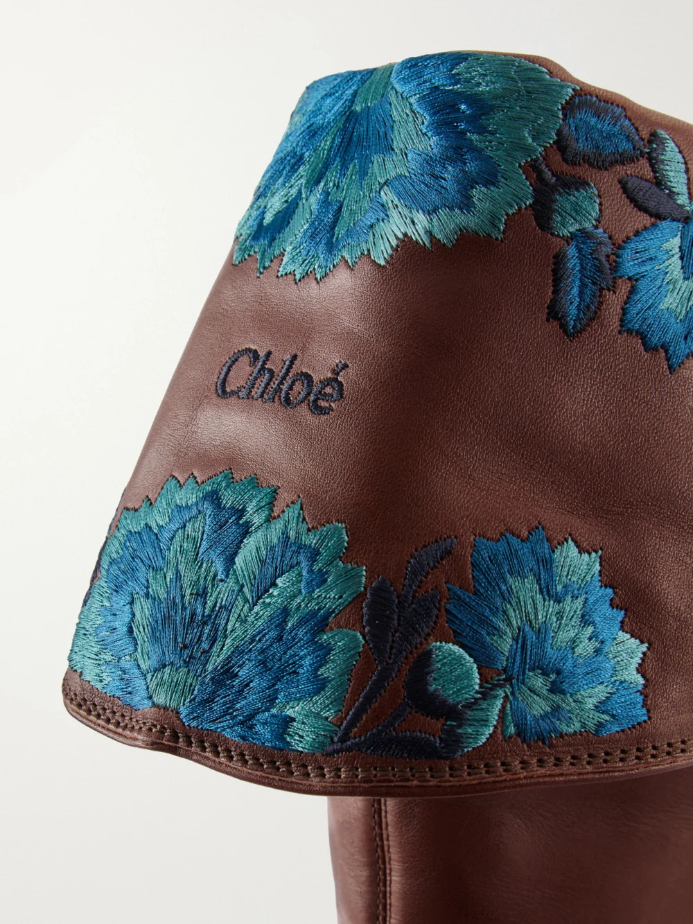 Close-up detail of the Chloé Azelan Floral-embroidered Leather Over-the-knee Boots