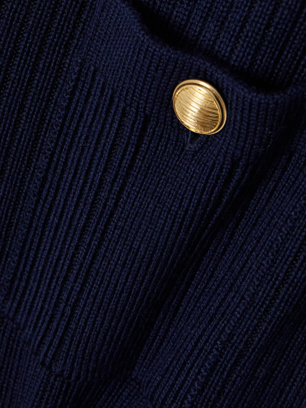Close-up detail of the Chloé Belted Ribbed Wool-blend Mini Dress