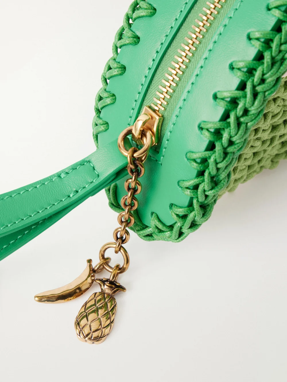Close-up detail of the Chloé Chloé Tropicus Leather-trimmed Woven Cotton Clutch