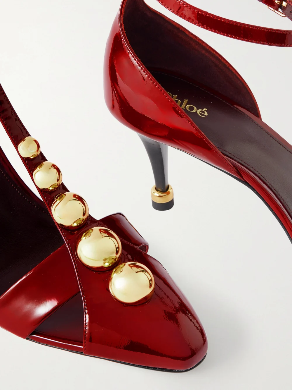 Close-up detail of the Chloé Cleiat Embellished Patent-leather Pumps