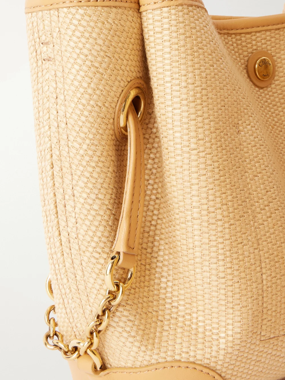 Close-up detail of the Chloé Clover Leather-trimmed Raffia-effect Tote
