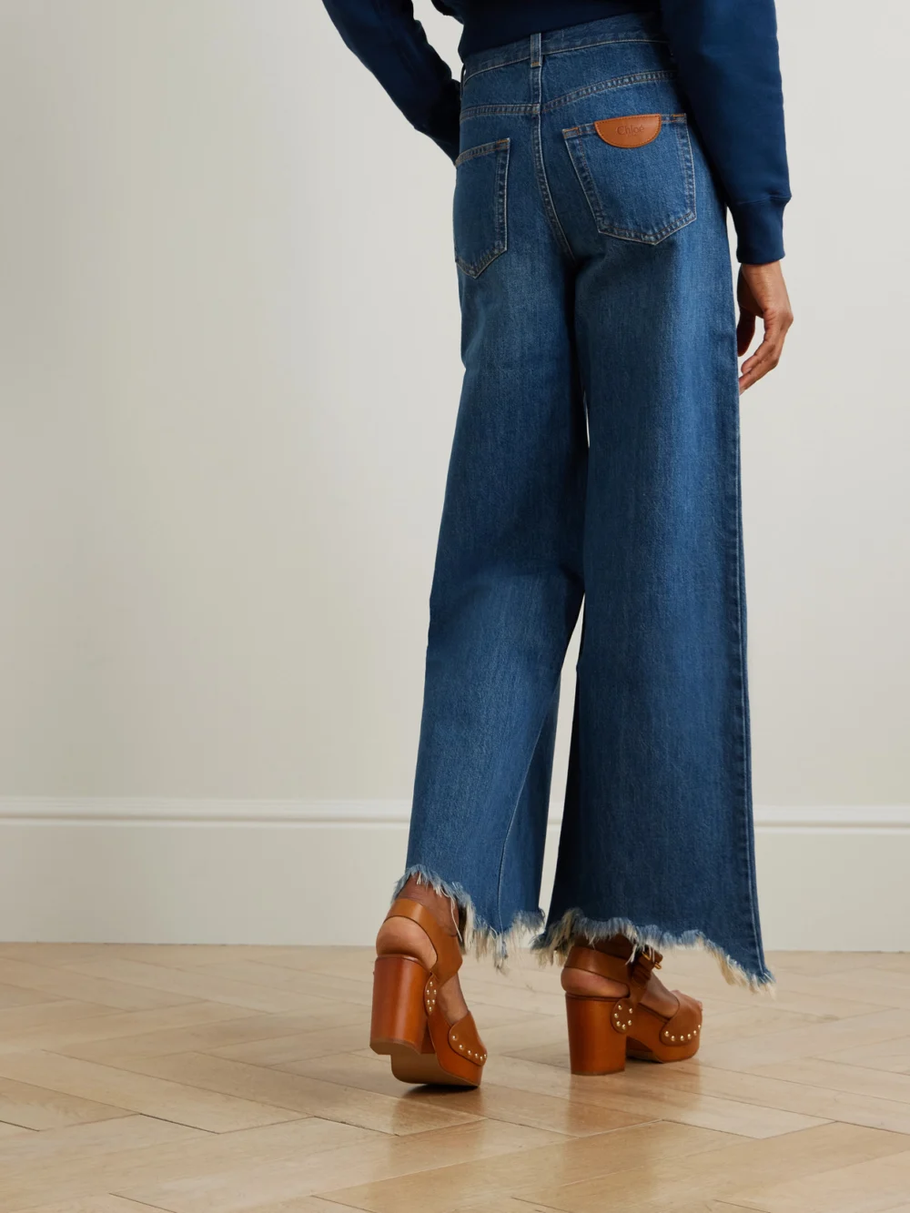 Back view of the Chloé Cropped Distressed High-rise Wide-leg Jeans