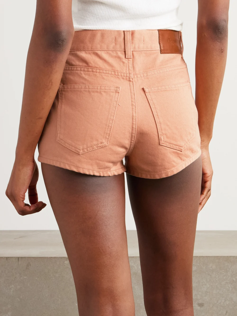 Back view of the Chloé Embellished Denim Shorts