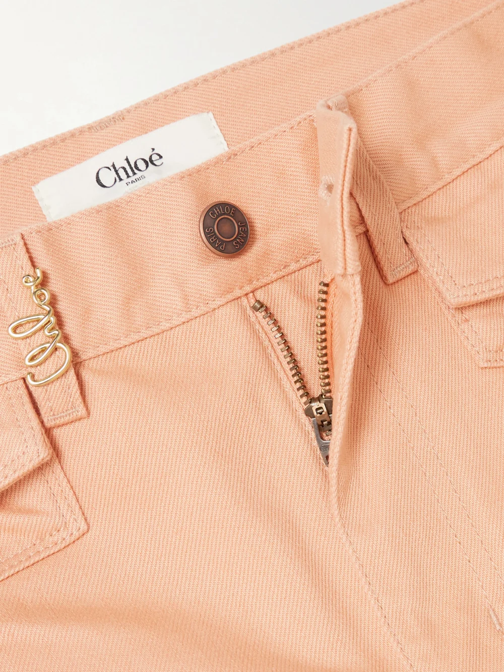 Close-up detail of the Chloé Embellished High-rise Straight-leg Jeans
