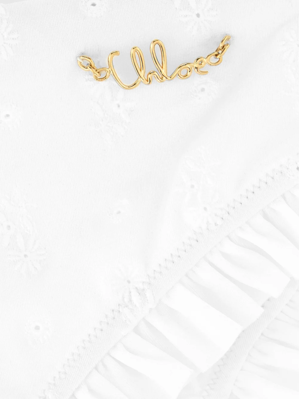 Close-up detail of the Chloé Embellished Ruffled Broderie Anglaise Bikini Briefs