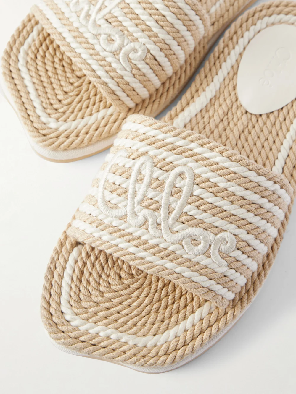 Close-up detail of the Chloé Embroidered Striped Cord Slides