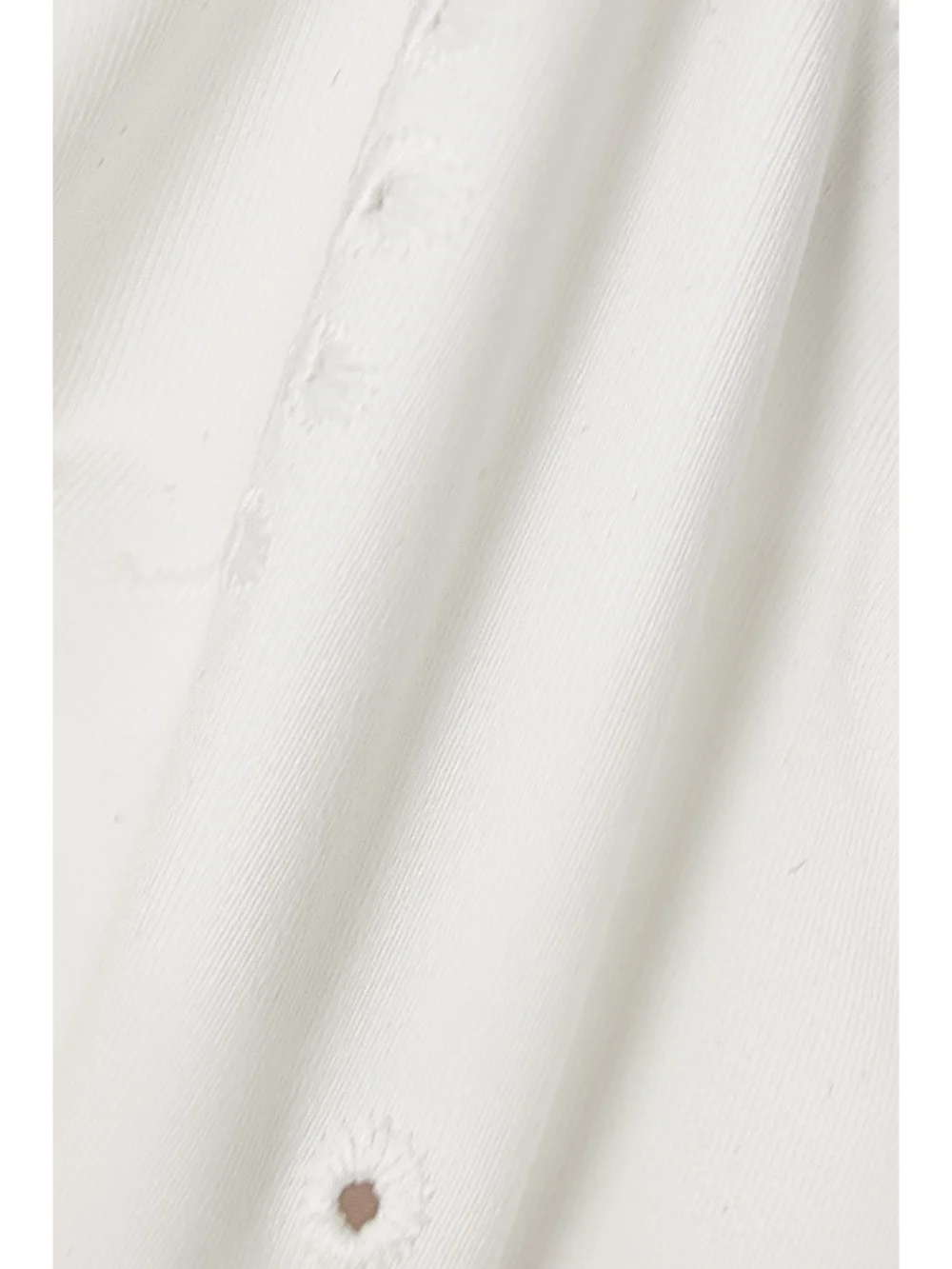 Close-up detail of the Chloé + Eres Broderie Anglaise Halterneck Bikini Top