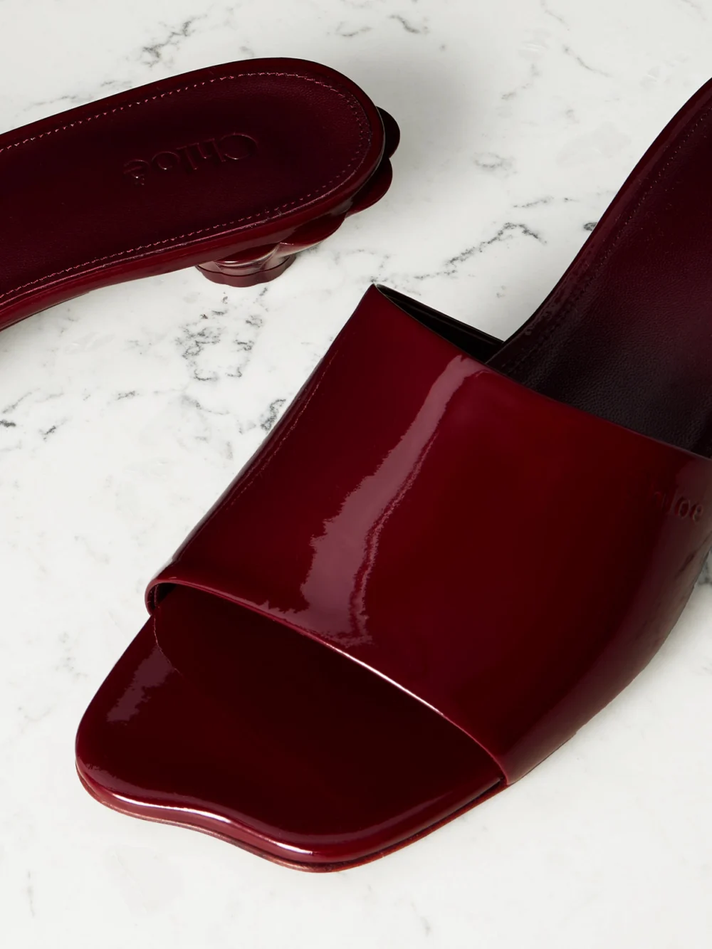 Close-up detail of the Chloé Flower Patent-leather Sandals