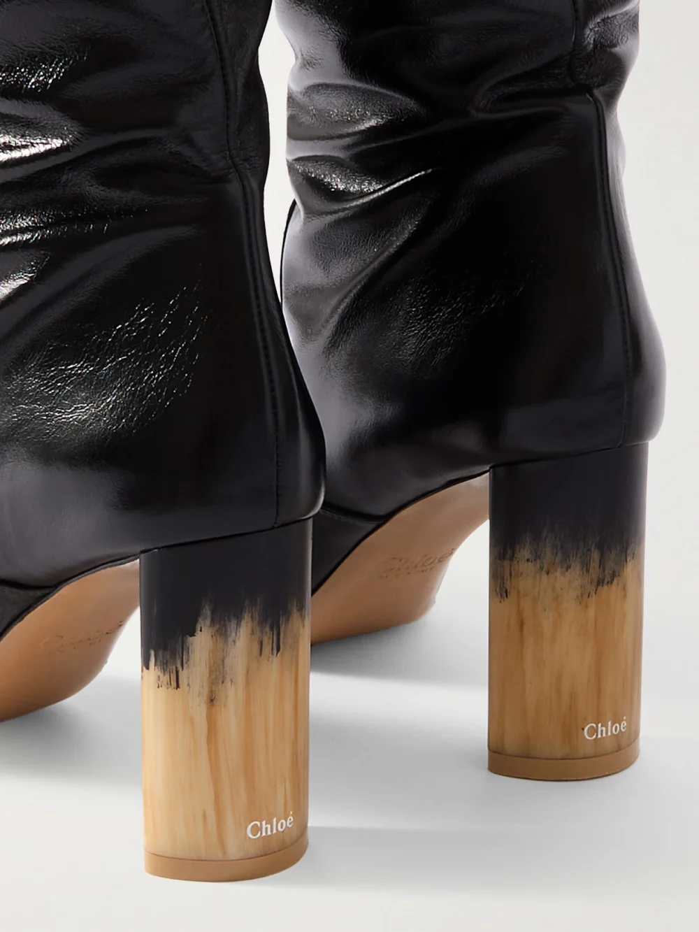 Close-up detail of the Chloé Georgia Ruched Polished-leather Knee Boots