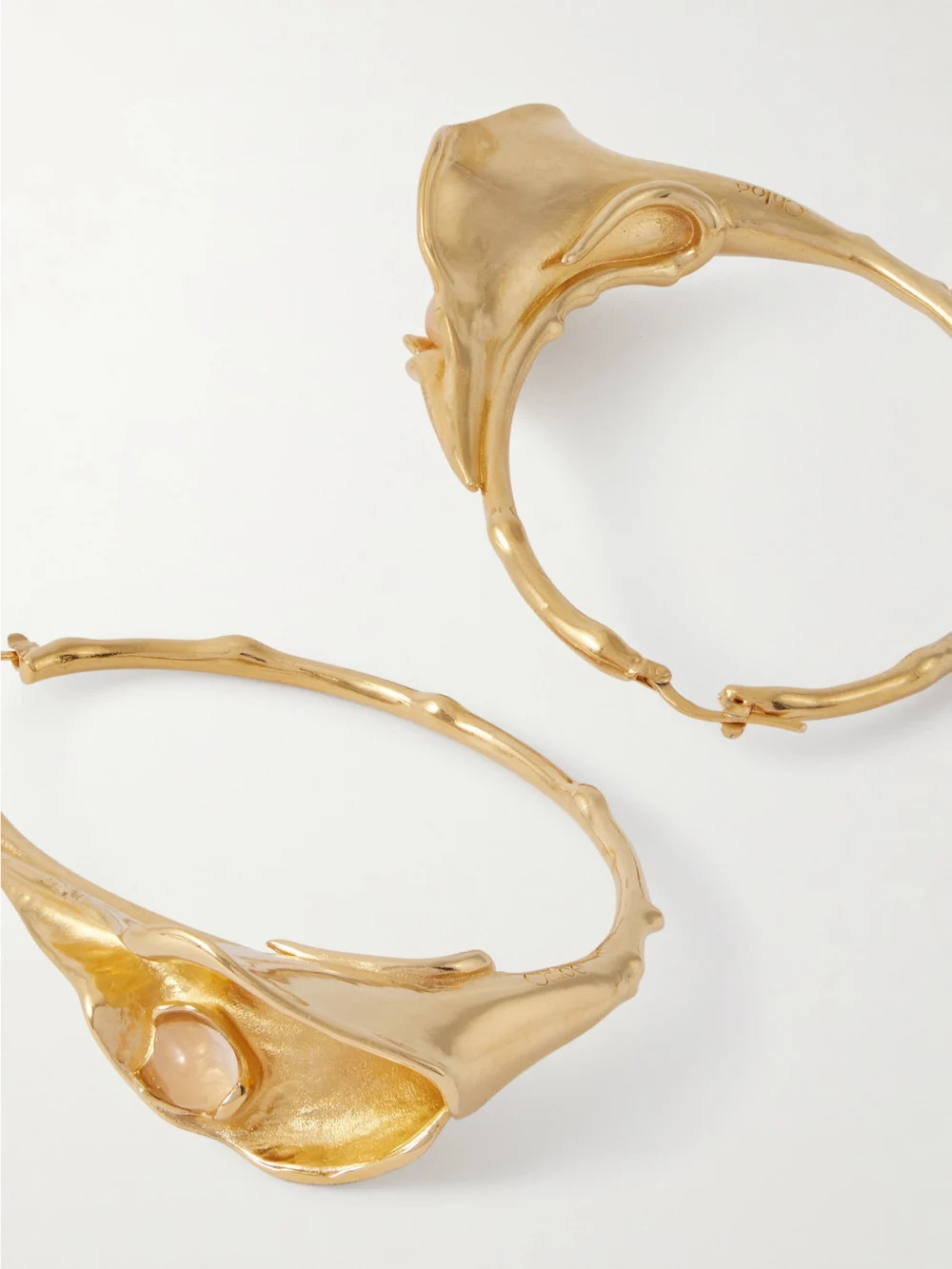 Close-up detail of the Chloé Gold-tone and Quartz Hoop Earrings