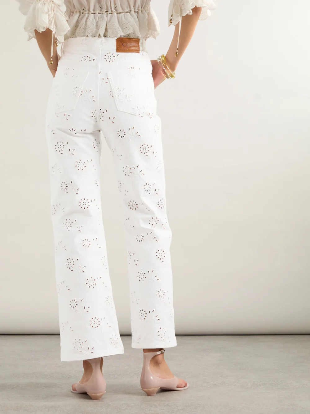 Back view of the Chloé High-rise Straight-leg Broderie Anglaise Organic Jeans