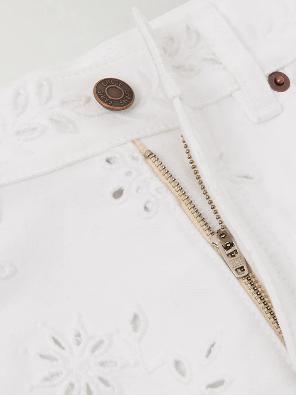 Close-up detail of the Chloé High-rise Straight-leg Broderie Anglaise Organic Jeans