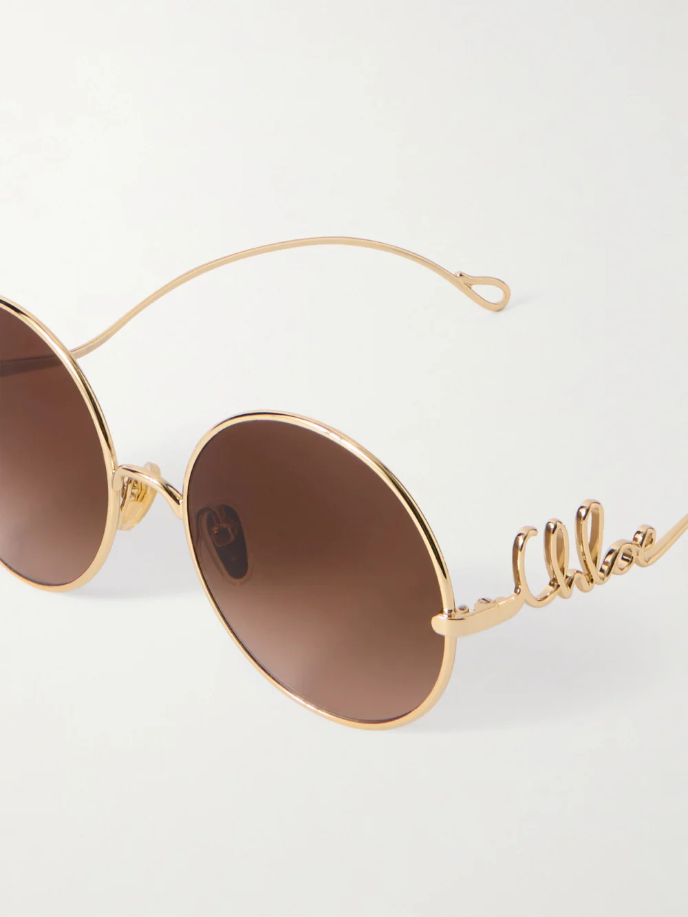 Close-up detail of the Chloé Iconic Round-frame Gold-tone Sunglasses
