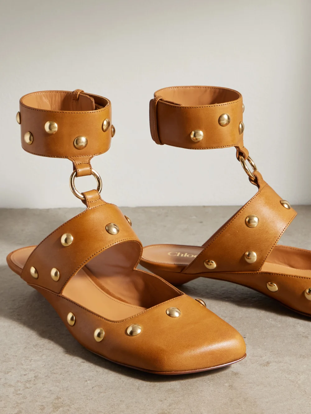 Close-up detail of the Chloé Jade Studded Leather Pumps
