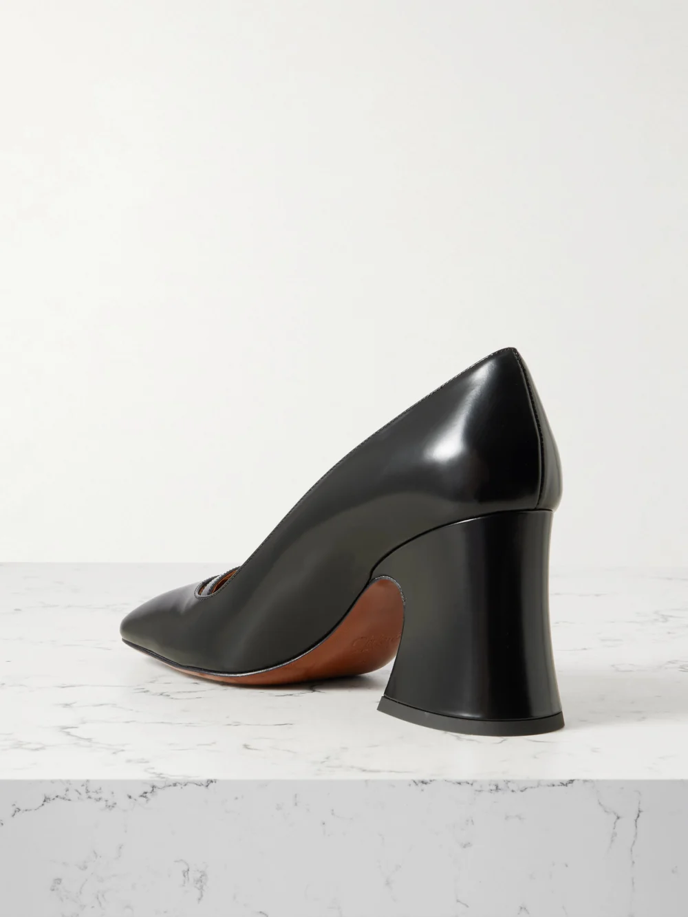 Back view of the Chloé Janis Buckled Glossed-leather Pumps