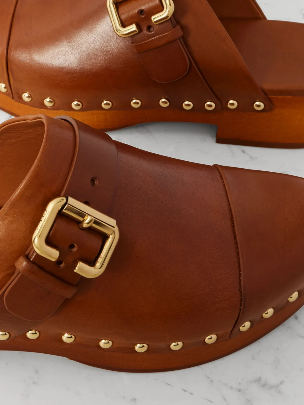 Close-up detail of the Chloé Jeannette Embellished Leather Clogs