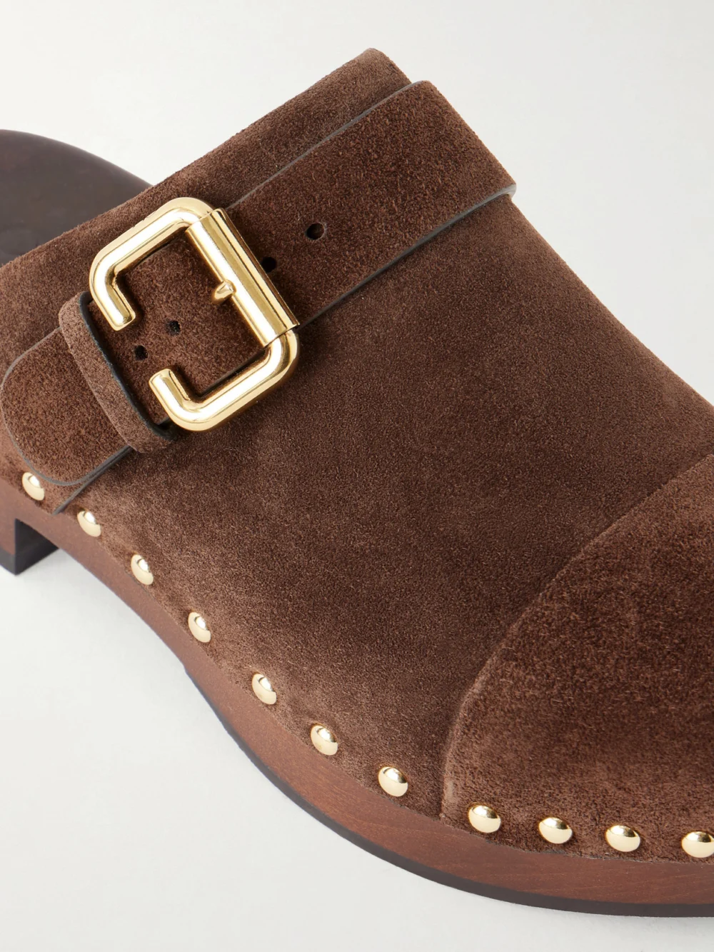 Close-up detail of the Chloé Jeannette Embellished Suede Clogs
