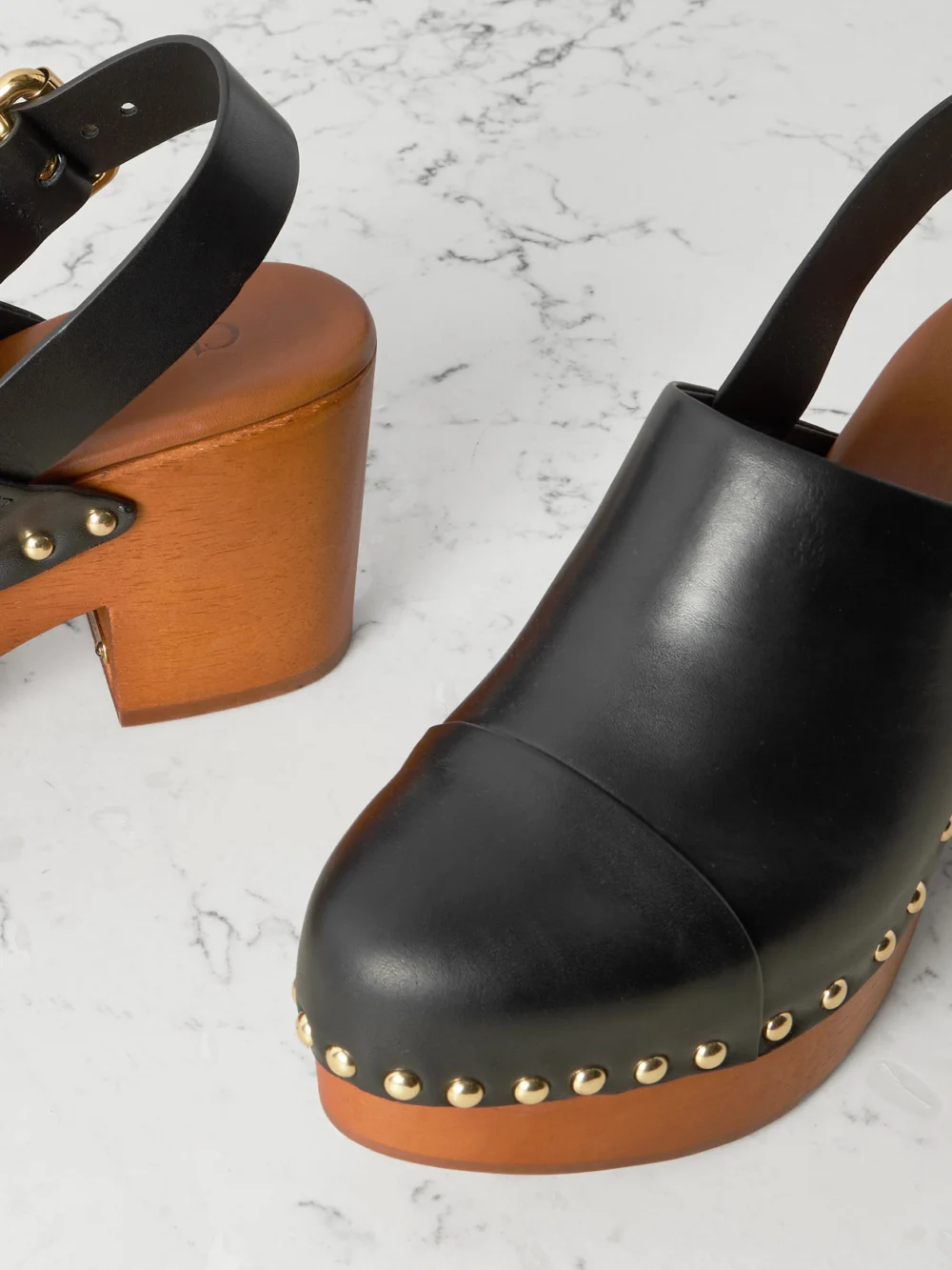 Close-up detail of the Chloé Jeannette Studded Leather Slingback Platform Clogs