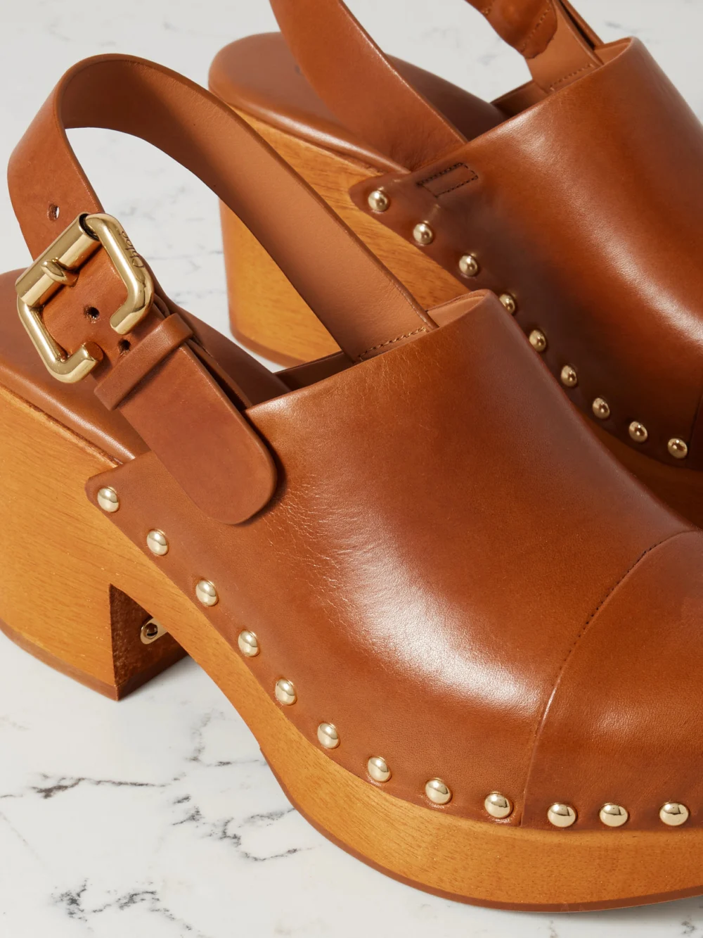 Close-up detail of the Chloé Jeannette Studded Leather Slingback Platform Clogs
