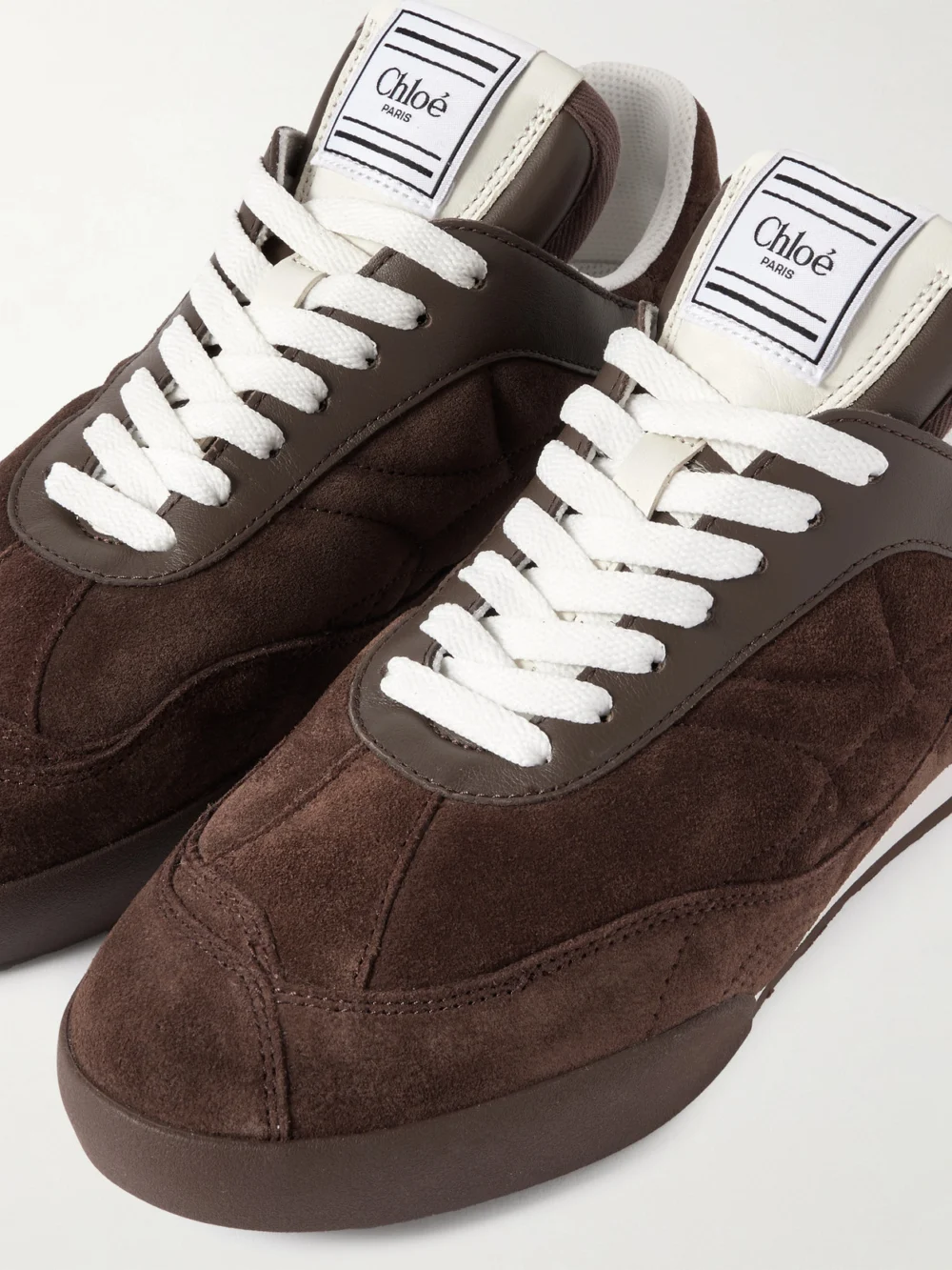 Close-up detail of the Chloé Kick Leather-trimmed Quilted Suede Sneakers