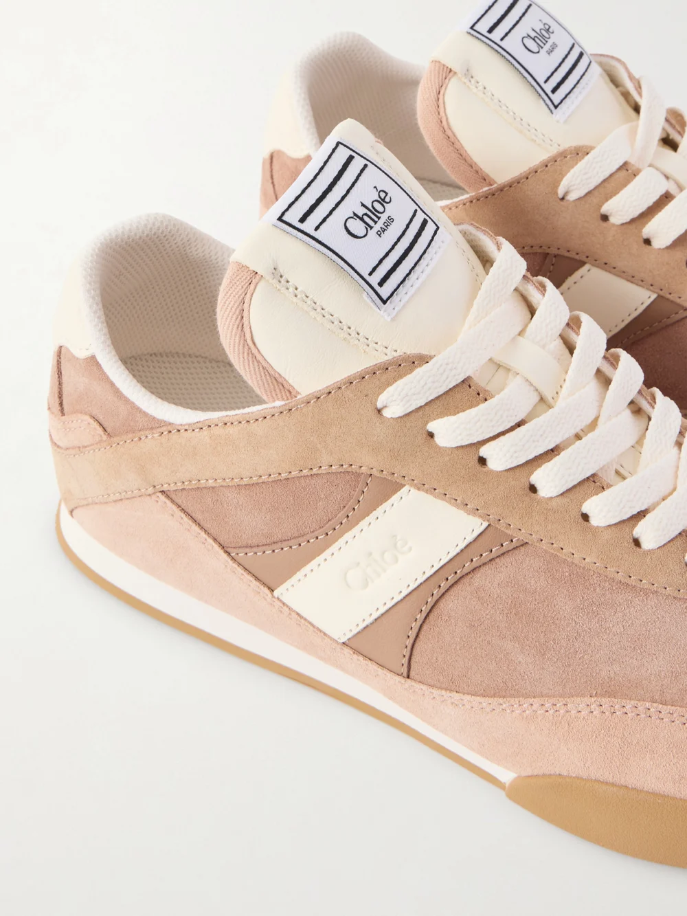 Close-up detail of the Chloé Kick Paneled Leather-trimmed Suede Sneakers