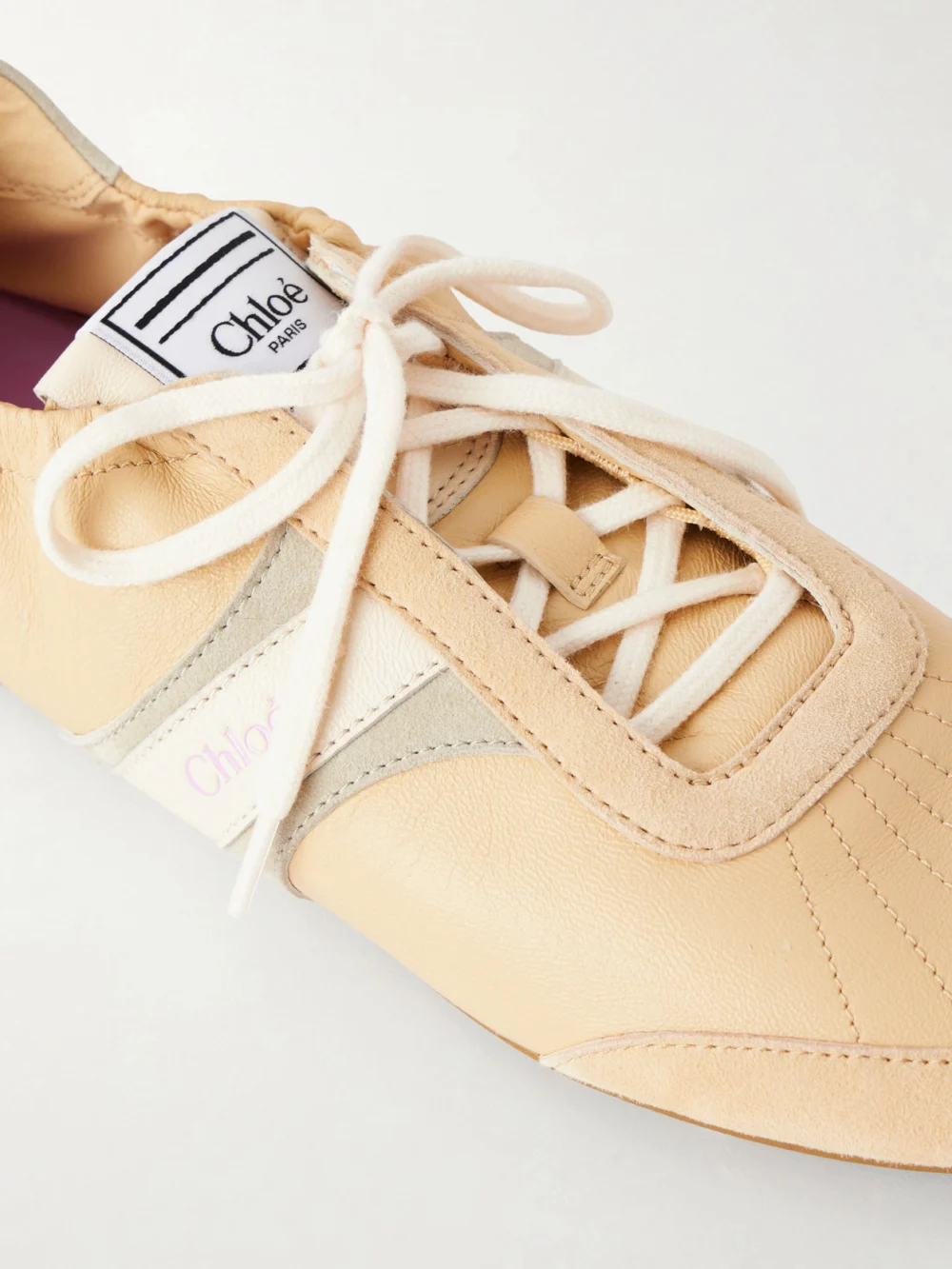 Close-up detail of the Chloé Kick Suede and Leather Sneakers