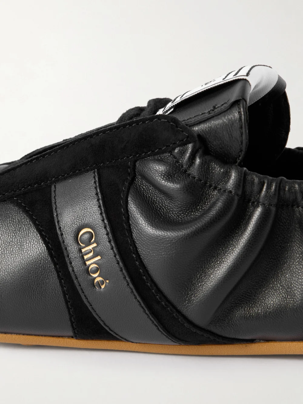 Close-up detail of the Chloé Kick Suede and Leather Sneakers