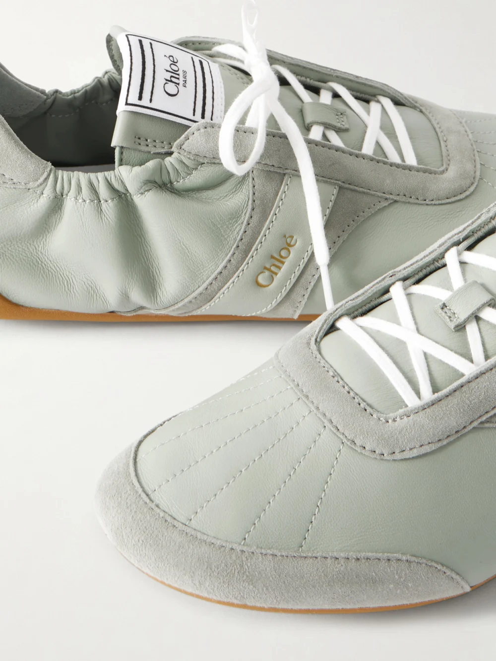 Close-up detail of the Chloé Kick Suede and Leather Sneakers