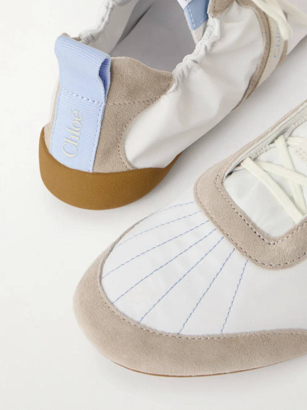 Close-up detail of the Chloé Kick Suede-trimmed Leather Sneakers