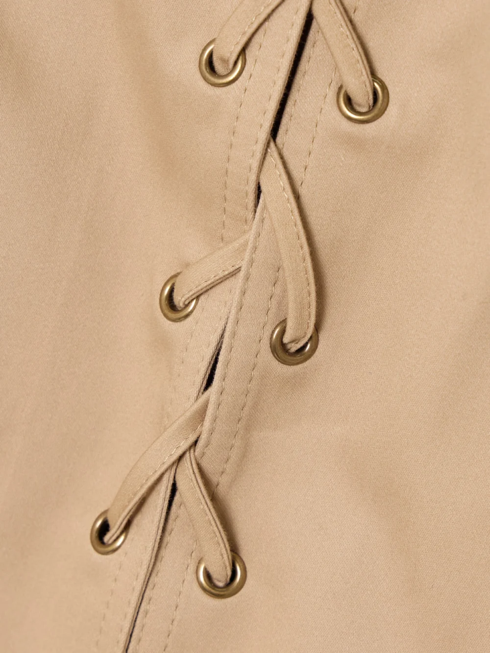Close-up detail of the Chloé Lace-up Cotton Mini Dress