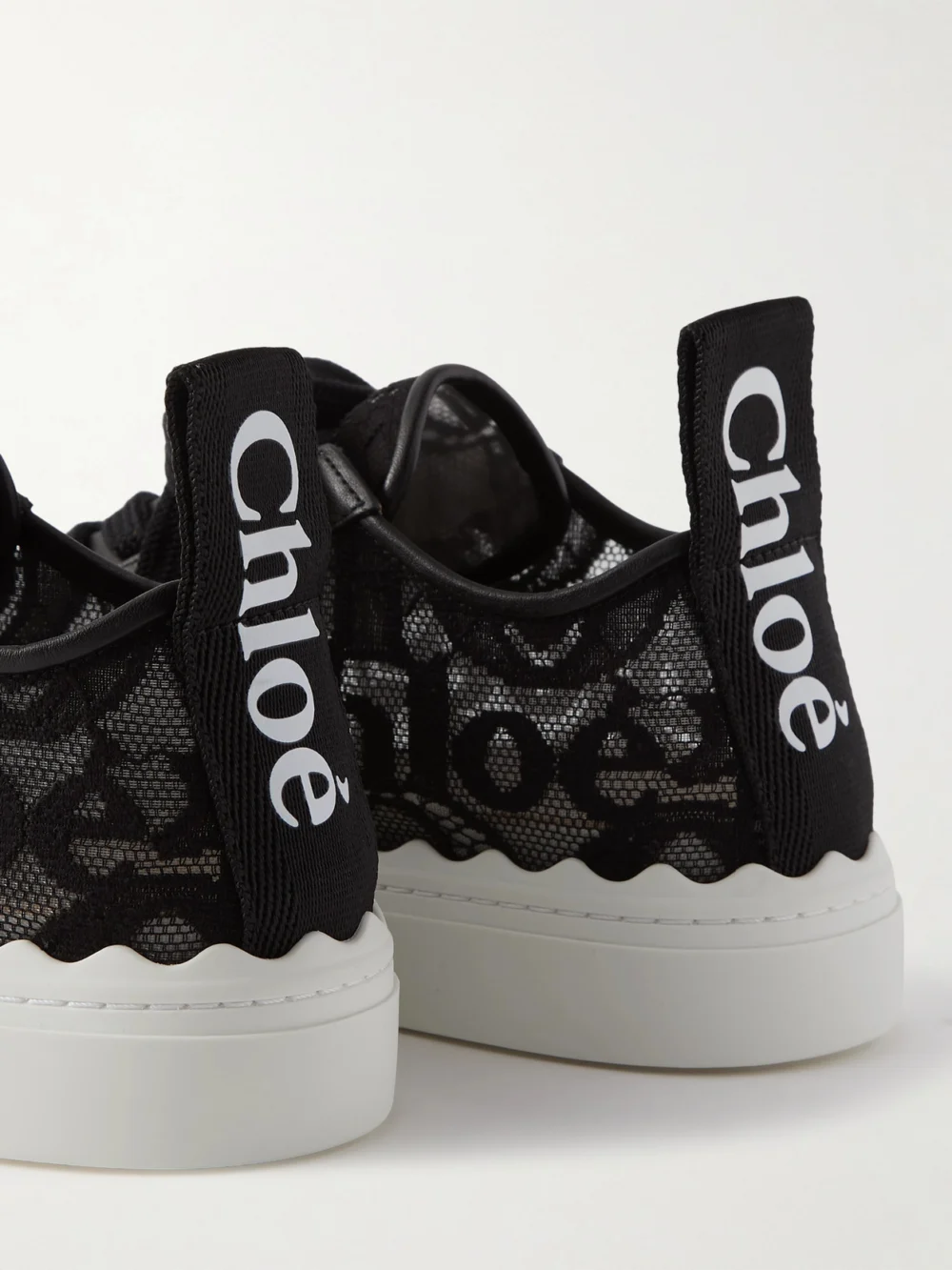 Close-up detail of the Chloé Lauren Scalloped Logo-detailed Lace and Leather Sneakers