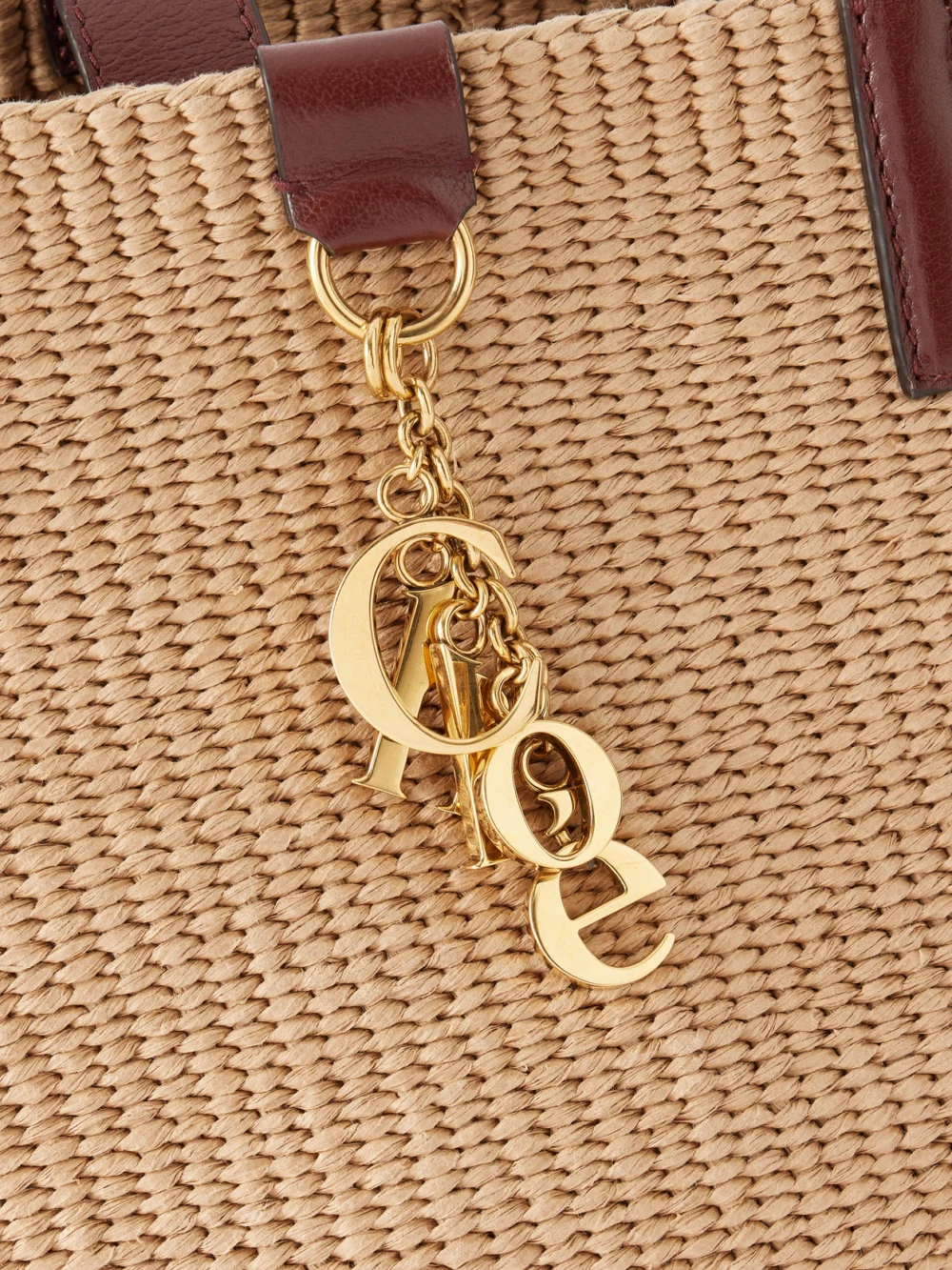 Close-up detail of the Chloé Leather-trimmed Raffia Tote Bag