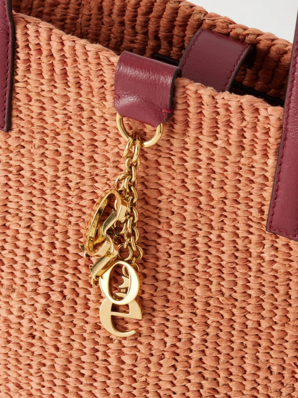 Close-up detail of the Chloé Leather-trimmed Raffia Tote Bag