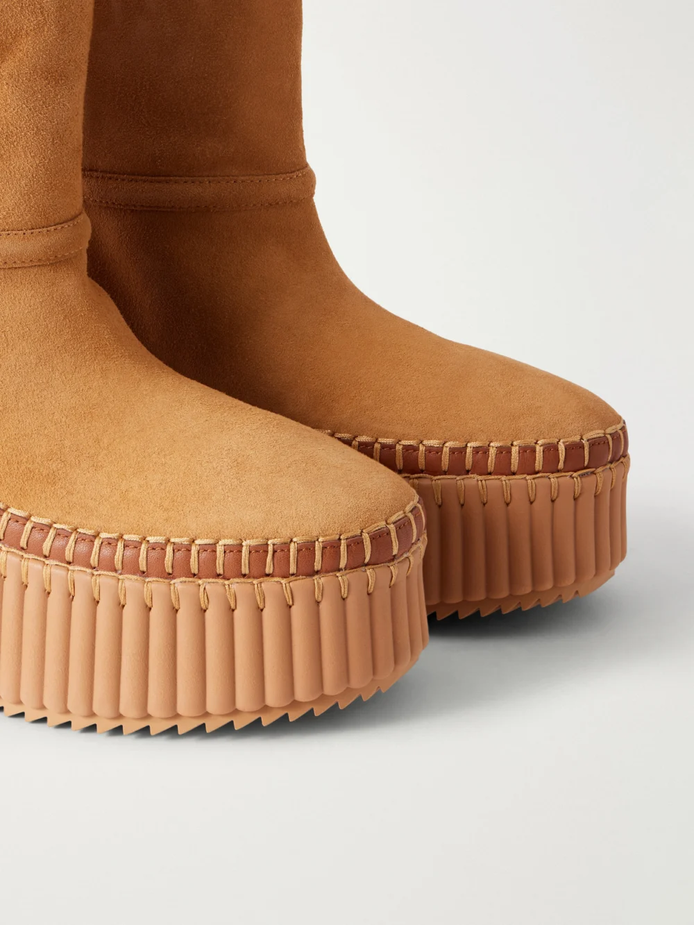 Close-up detail of the Chloé Nama 14 Shearling-trimmed Suede Wedge Ankle Boots