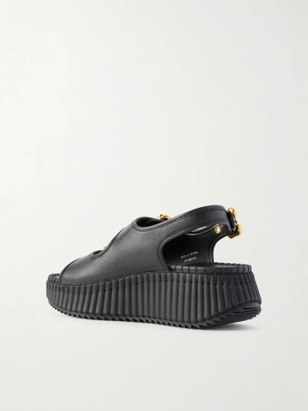 Back view of the Chloé Nama Buckled Leather Wedge Sandals