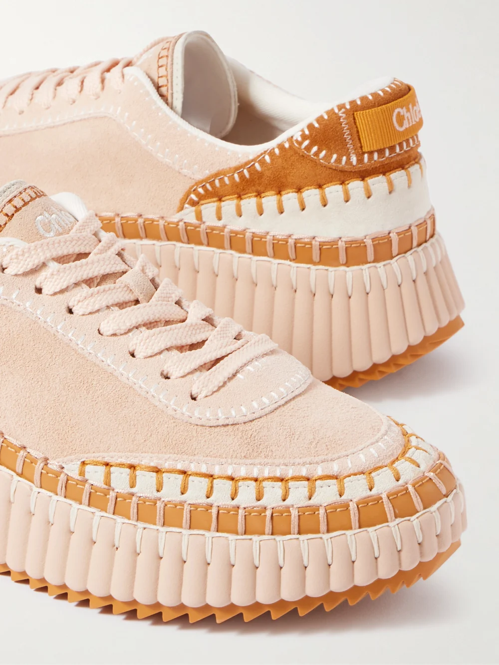 Close-up detail of the Chloé Nama Embroidered Leather-trimmed Suede Platform Sneakers