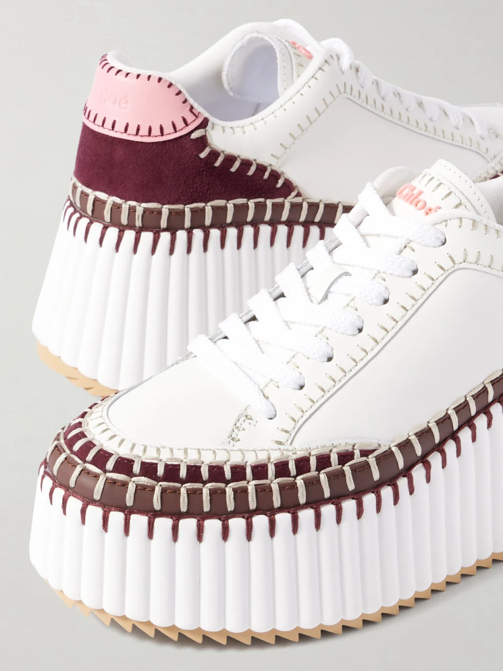 Close-up detail of the Chloé Nama Embroidered Suede-trimmed Leather Platform Sneakers